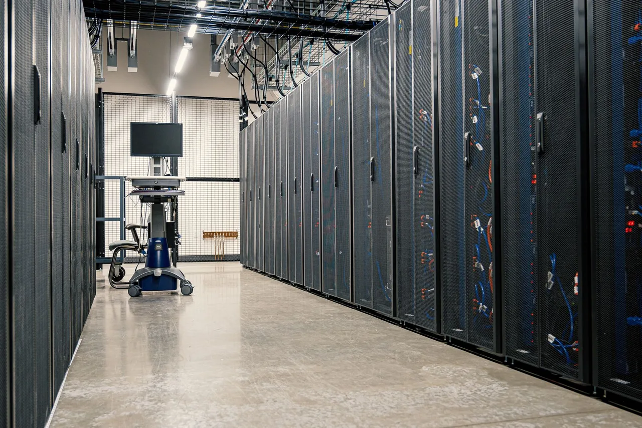 Rows of server racks in a modern data center corridor