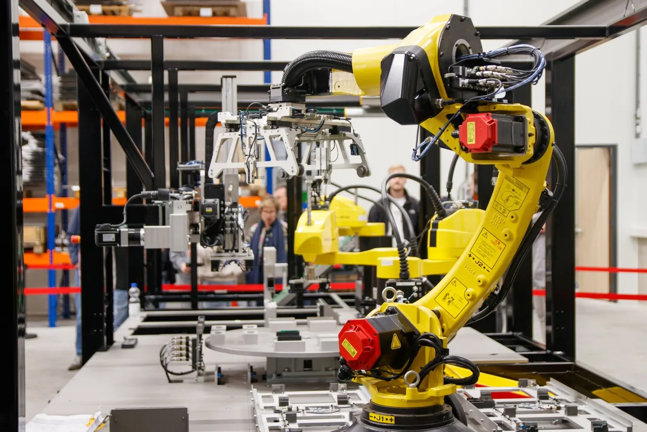 An industrial robotic arm operating on a factory production line